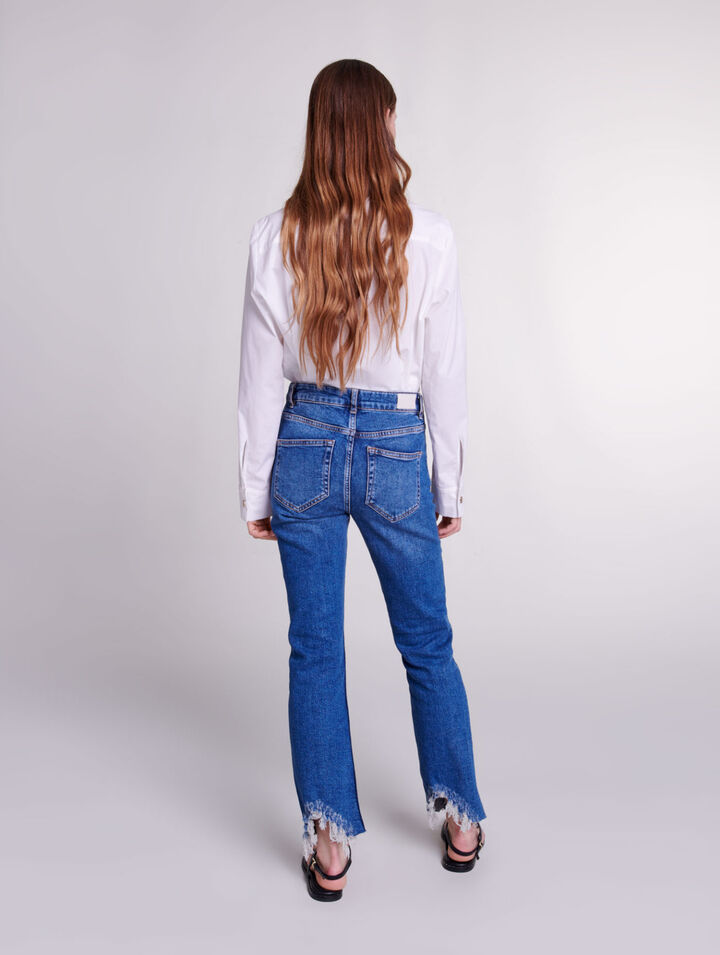 Röhrenjeans mit Rissen