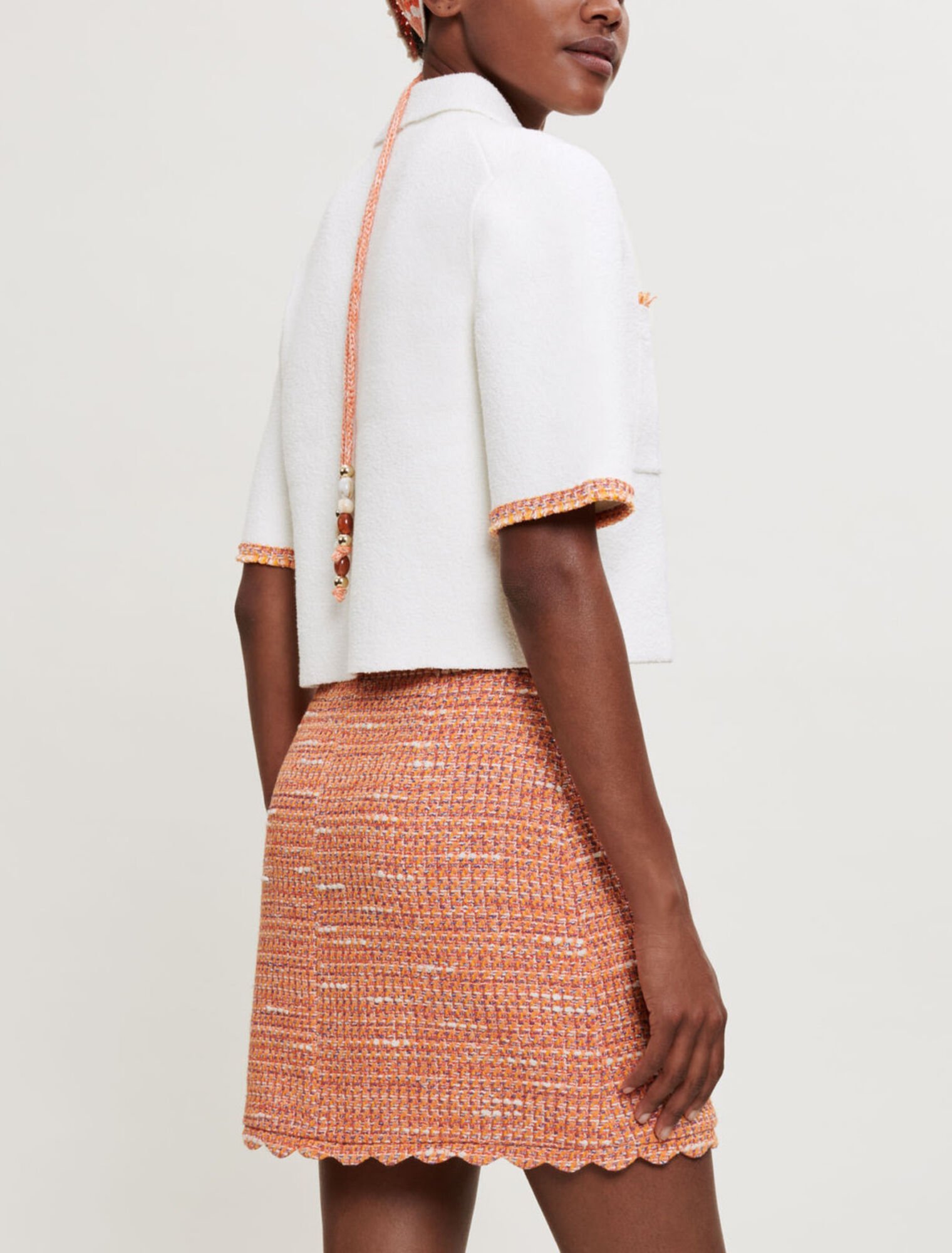 Tweedrock mit geflochtenen Borten