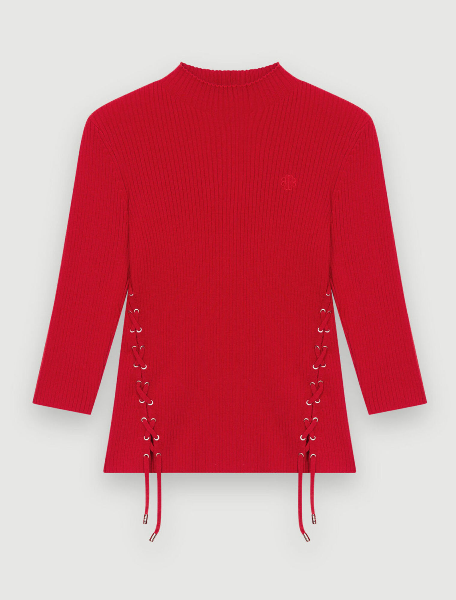 Körpernaher Pullover mit silbernen Ösen