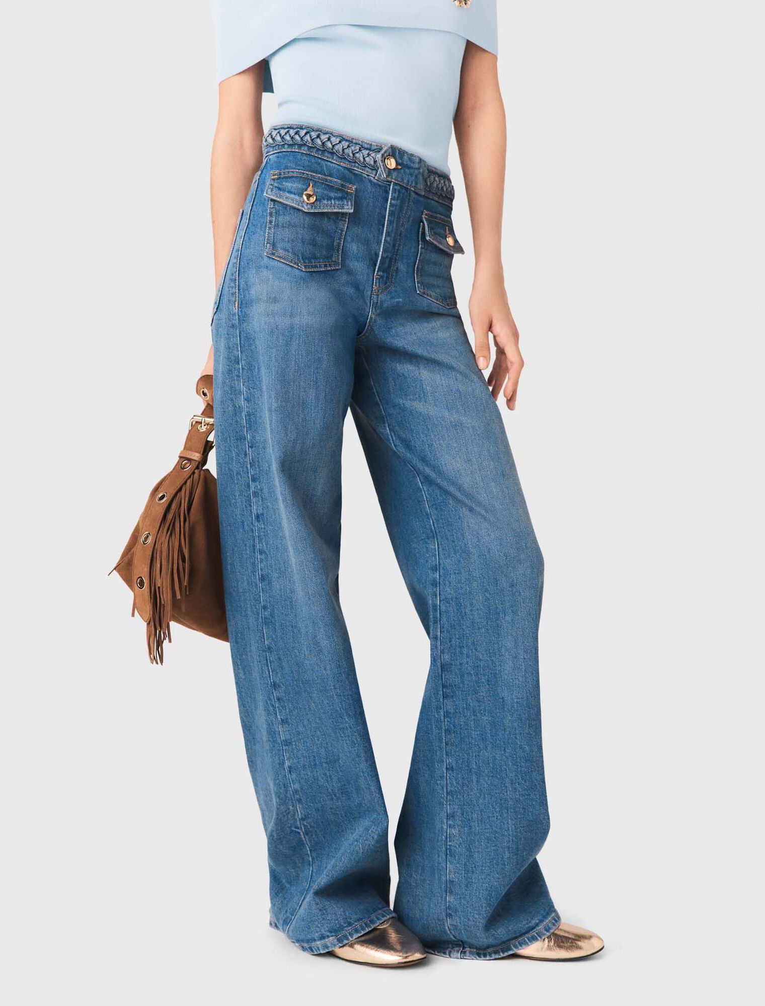 Schlagjeans mit Flechtdetails