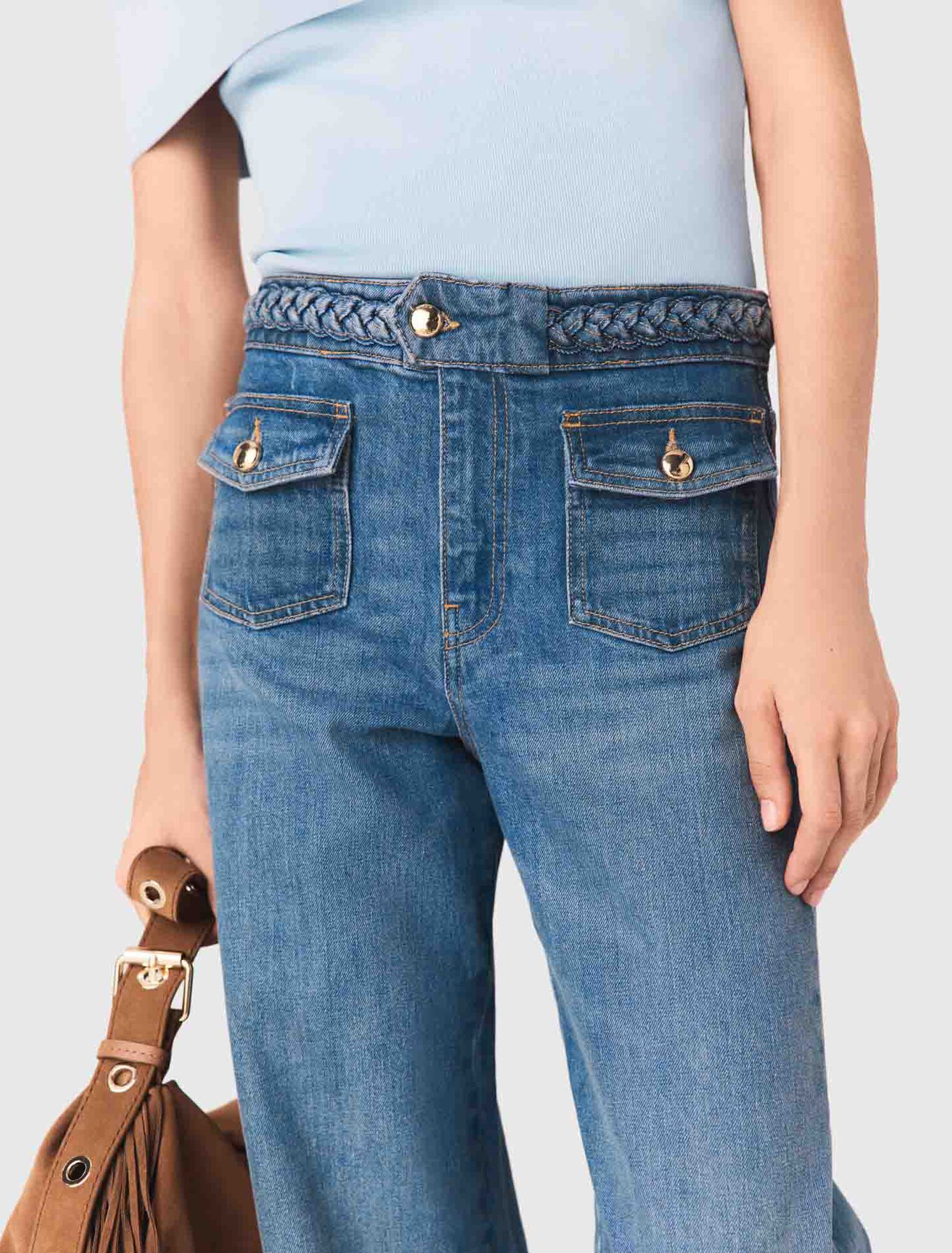 Schlagjeans mit Flechtdetails