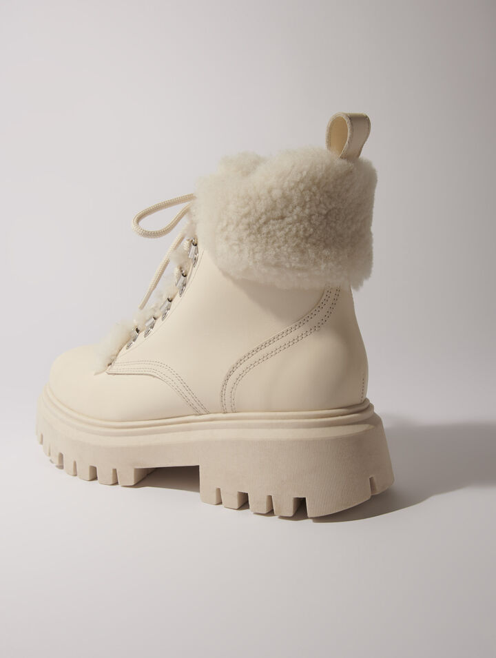 Klobige Stiefeletten aus Kunstfell