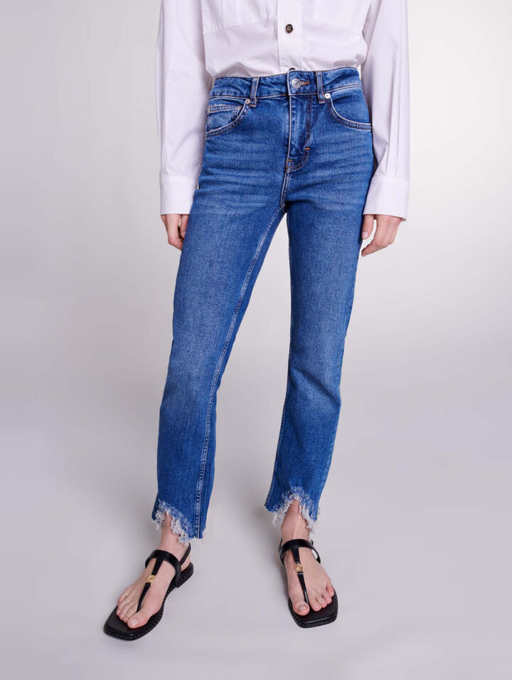 Röhrenjeans mit Rissen